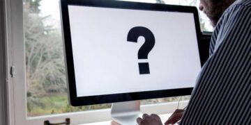 using computer with large question mark on screen 2025 01 07 22 14 13 utc