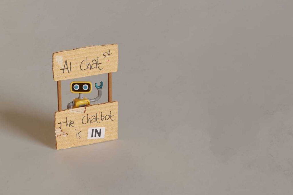yellow toy robot manning ai chat stand 2024 10 18 06 40 39 utc