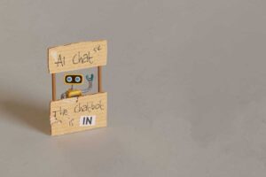 yellow toy robot manning ai chat stand 2024 10 18 06 40 39 utc