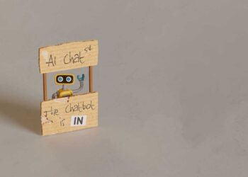 yellow toy robot manning ai chat stand 2024 10 18 06 40 39 utc
